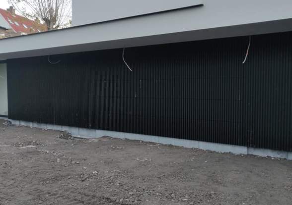 Portes sectionelle aspect bois/alu  - Hörmann - Montré & Laga
