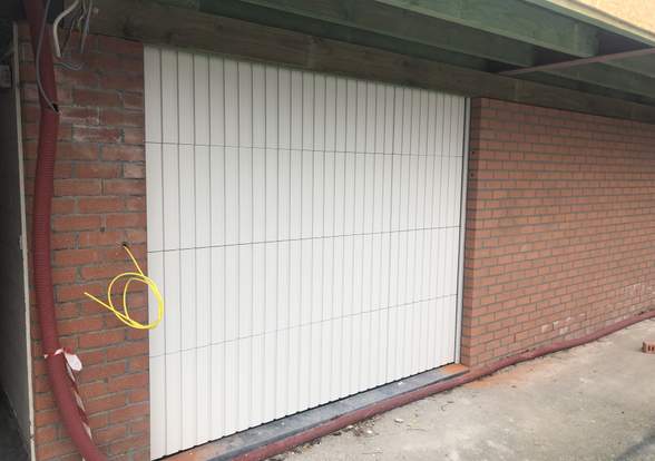 Portes sectionelle aspect bois/alu  - Hörmann - Montré & Laga