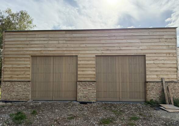 Portes sectionelle aspect bois/alu  - Hörmann - Montré & Laga
